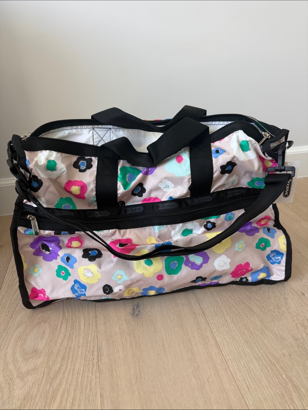 LeSportsac Floral Print Travel Duffel Bag in Cream and Black